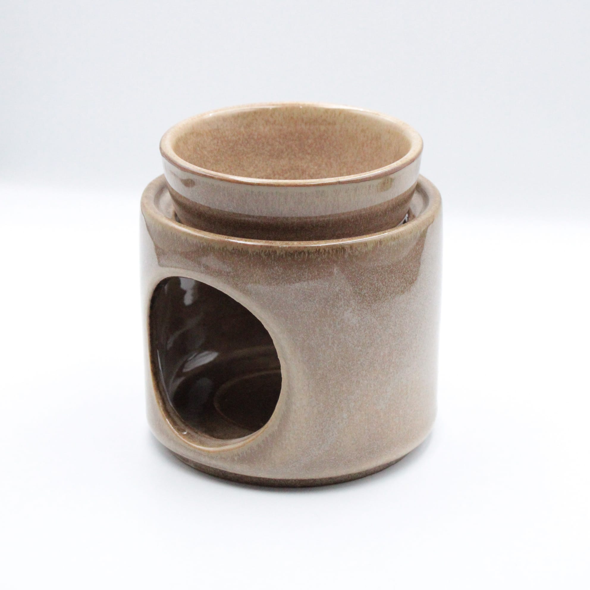 Beżowy ceramiczny kominek na wosk zapachowy widok z przodu